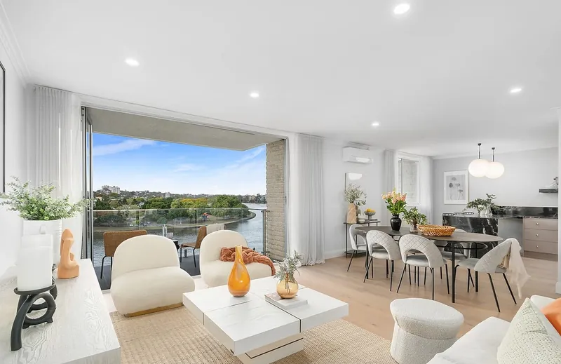 Renovated apartment living and dining area with LED downlights and pendant lights
