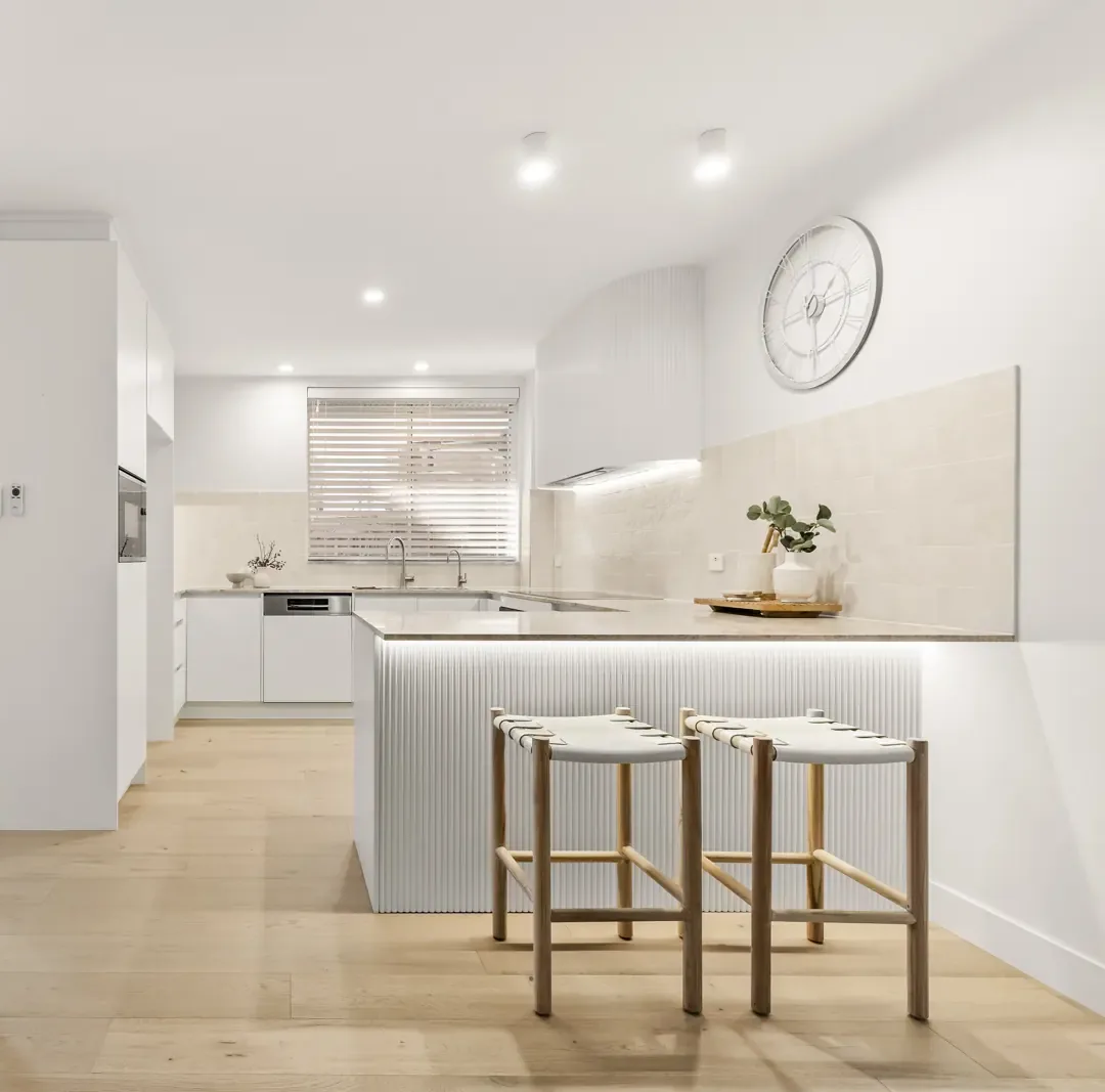 Renovated Toowong apartment kitchen with surface-mounted LED downlights and LED strip lighting under the island bench