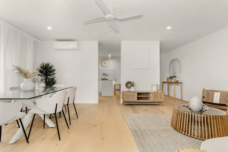 Living and dining area with split system air conditioner, low-profile ceiling fan and LED downlights