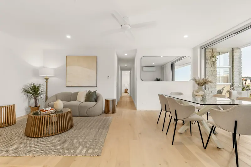 Open living and dining area with LED downlights and ceiling fan