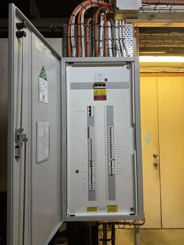 Inside a modern switchboard with circuit breakers and safety switches