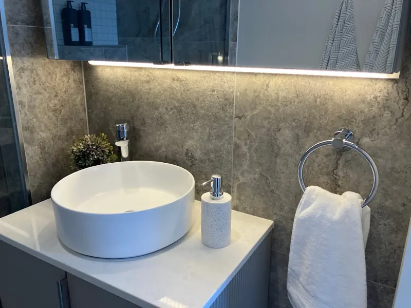 LED strip lighting installed under a bathroom vanity
